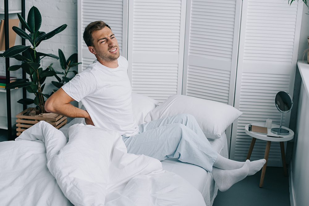 How To Sleep With Lower Back Pain: 11 Practical Tips