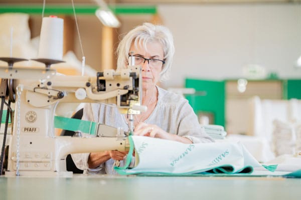 handmade bed - sewing machine operated by people