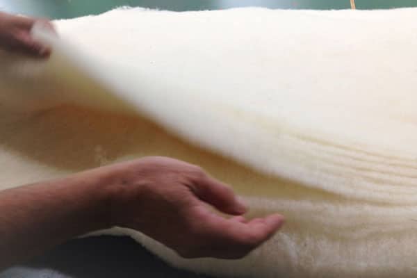 handcrafted samina - sorting layers of combed wool